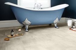 blue clawfoot bath with light grey stone tiled vinyl bathroom flooring